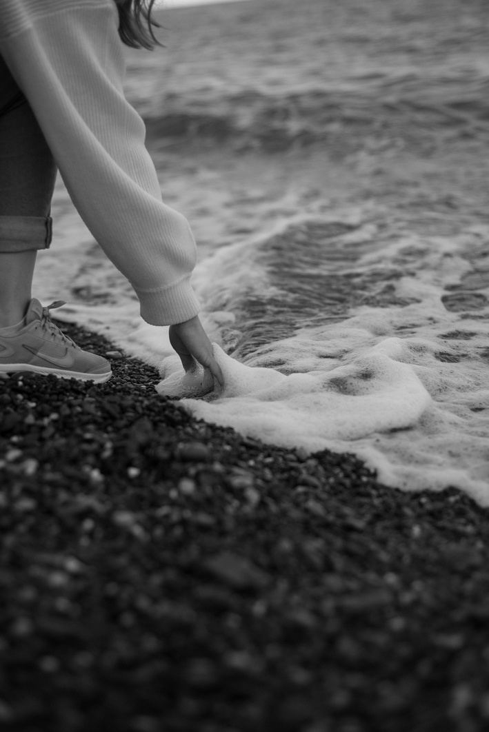 Woman Touching Sea Foam